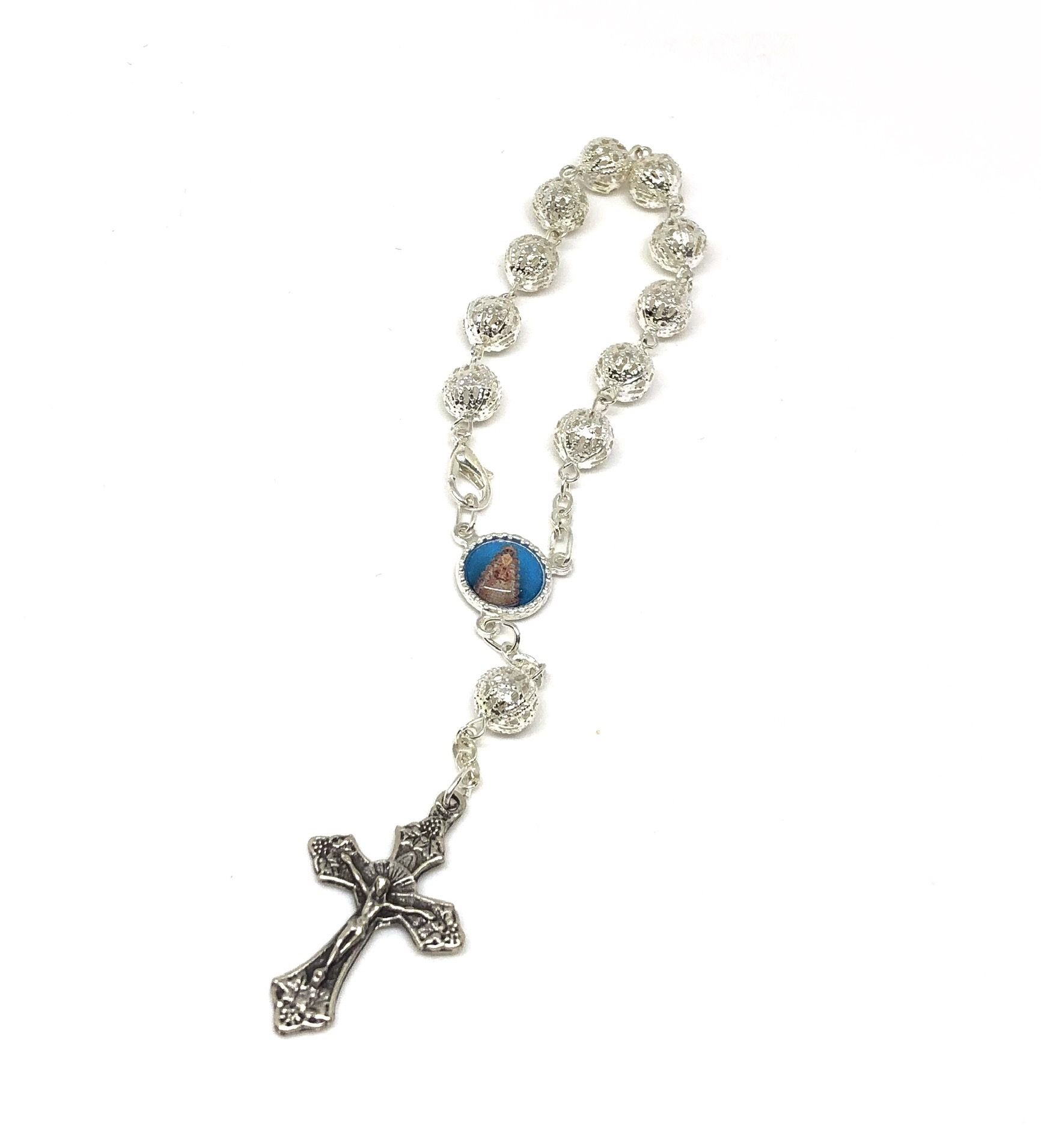 Virgin del Rocio hand rosary made of large round filigree beads made of silver plated metal. Includes metal cross.